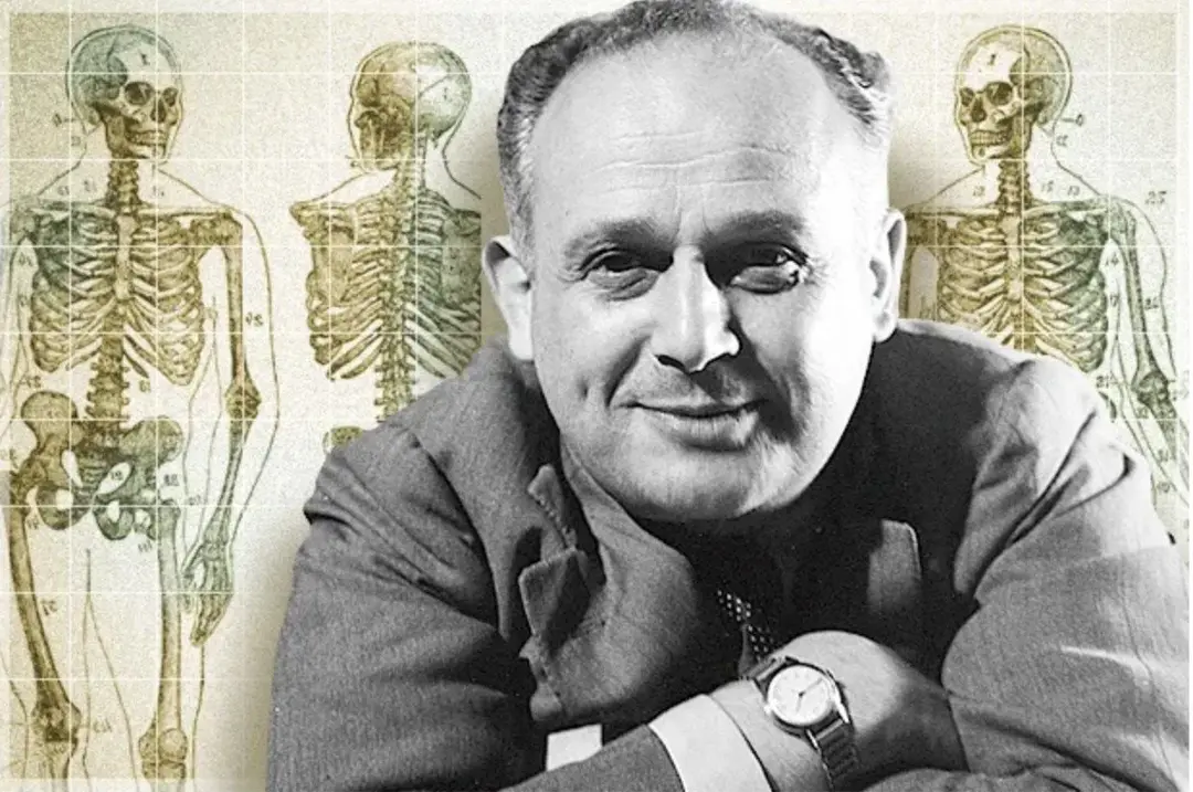 Moshe Feldenkrais in a black and white portrait in front of vintage anatomical skeleton diagrams
