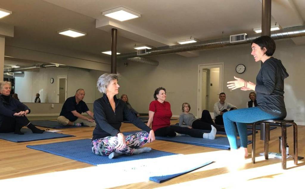 Dayana guiding a group in Awareness Through Movement